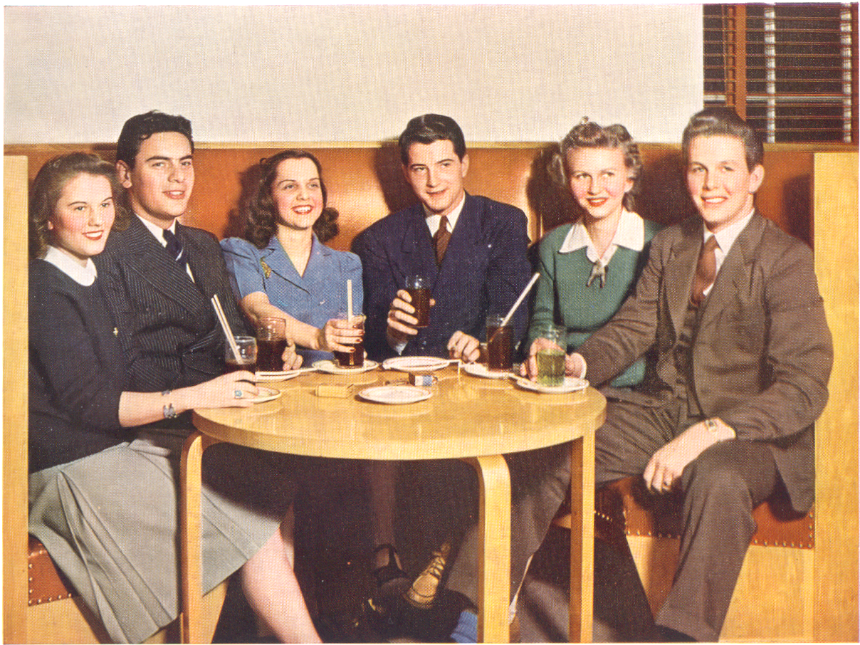 A group of friends enjoying a coke date.