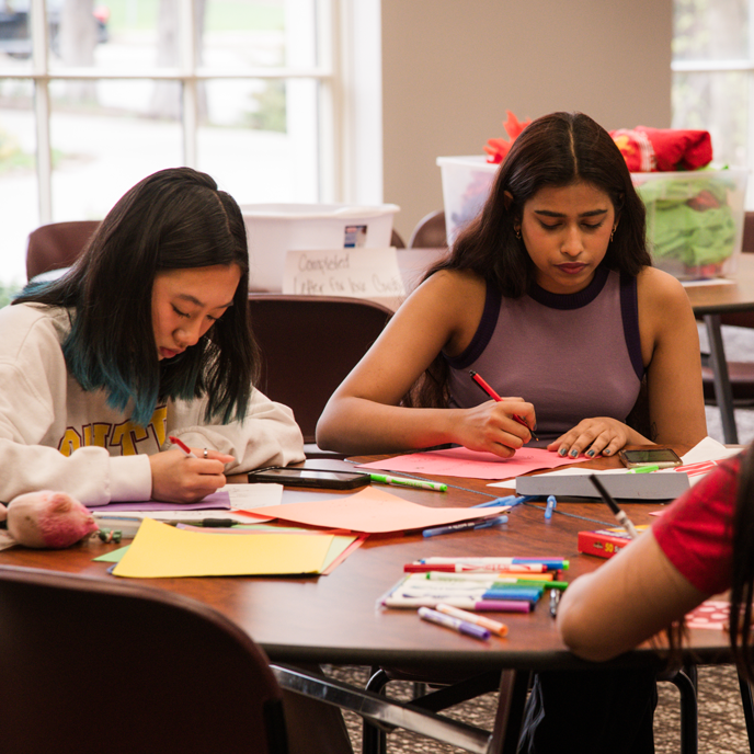 Two students making cards during Campus Service Day