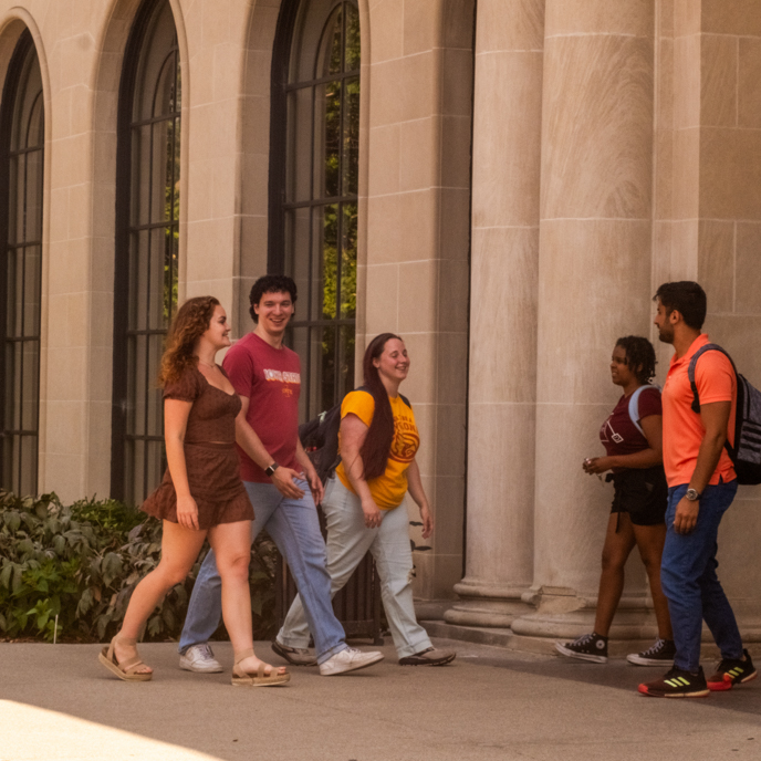 Students walking in and out of the North entrance of the Memorial Union
